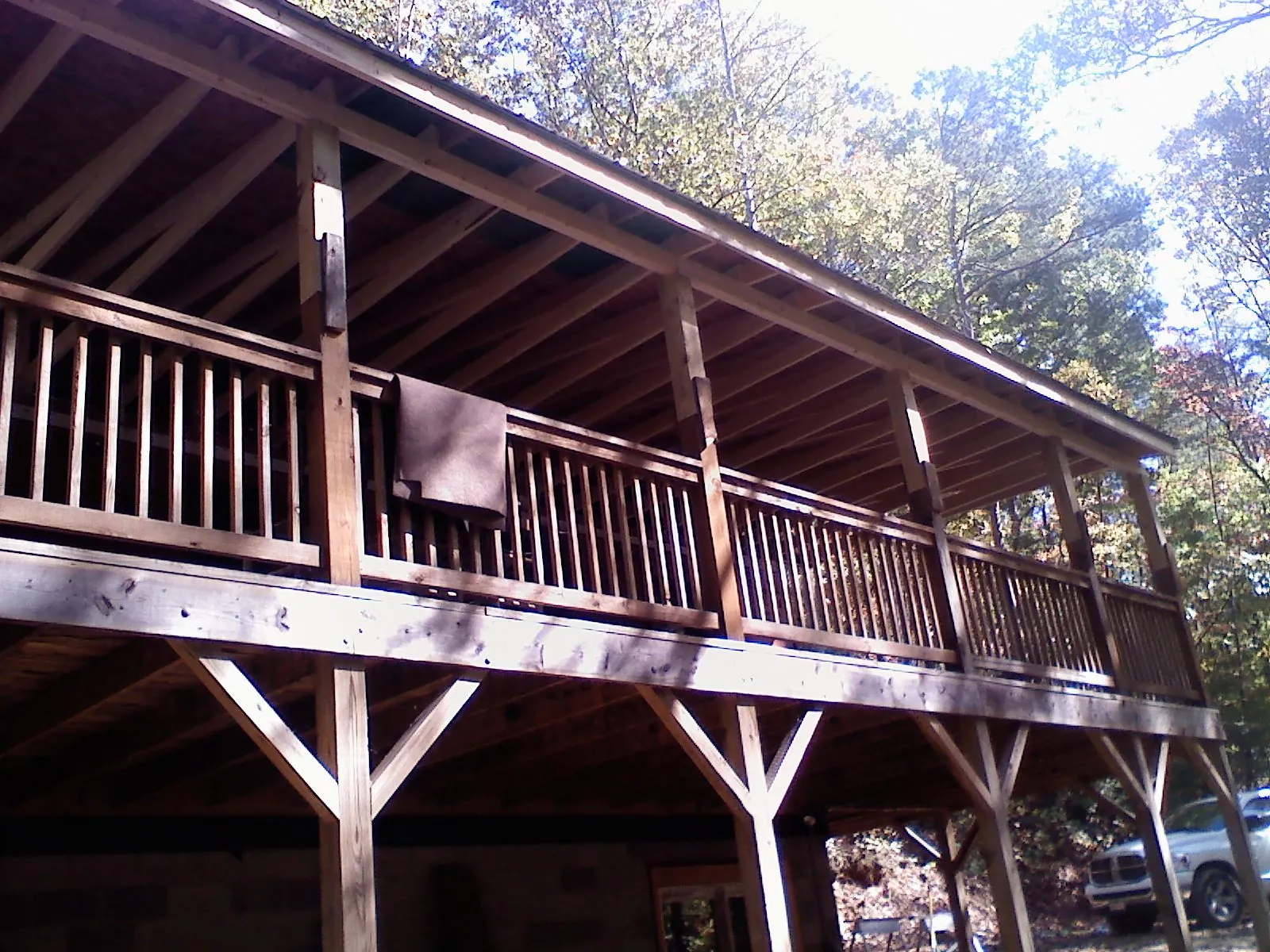 Timber framing under a new elevated porch and deck — Roof Leak Repair in Vassar by Roofing Brothers